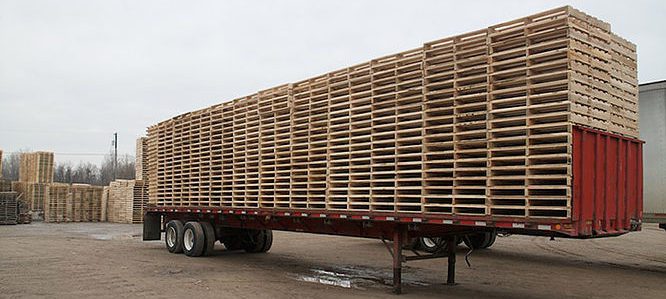 dropped trailer full of wood pallets